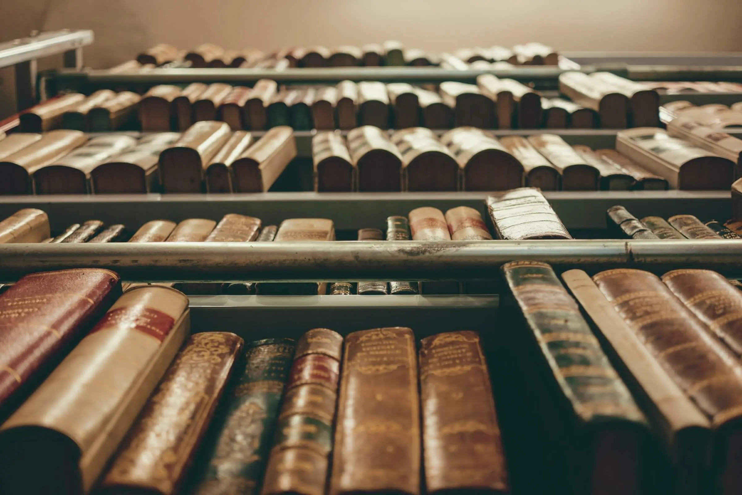 Looking up at books on shelves in a library