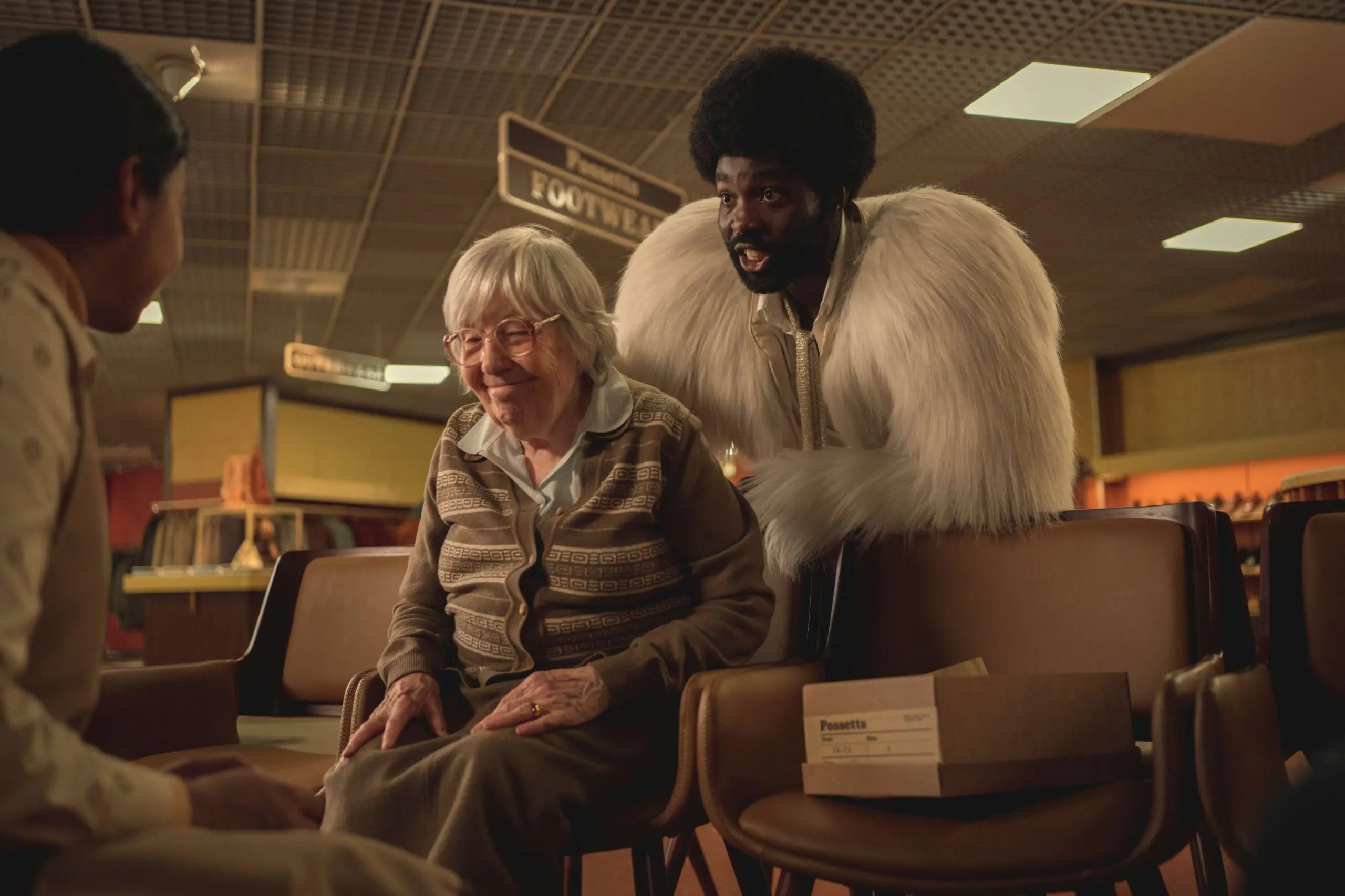 Red Book. (L to R) Anjana Vasan as Nida, Janie Booth as Sweet Gran, Paapa Essiedu as Gaap in Red Book in Black Mirror Demon 79