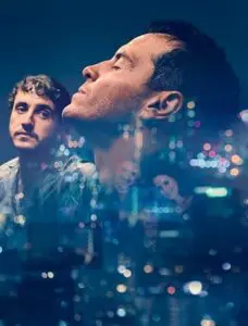 Two men against a night city skyline backdrop