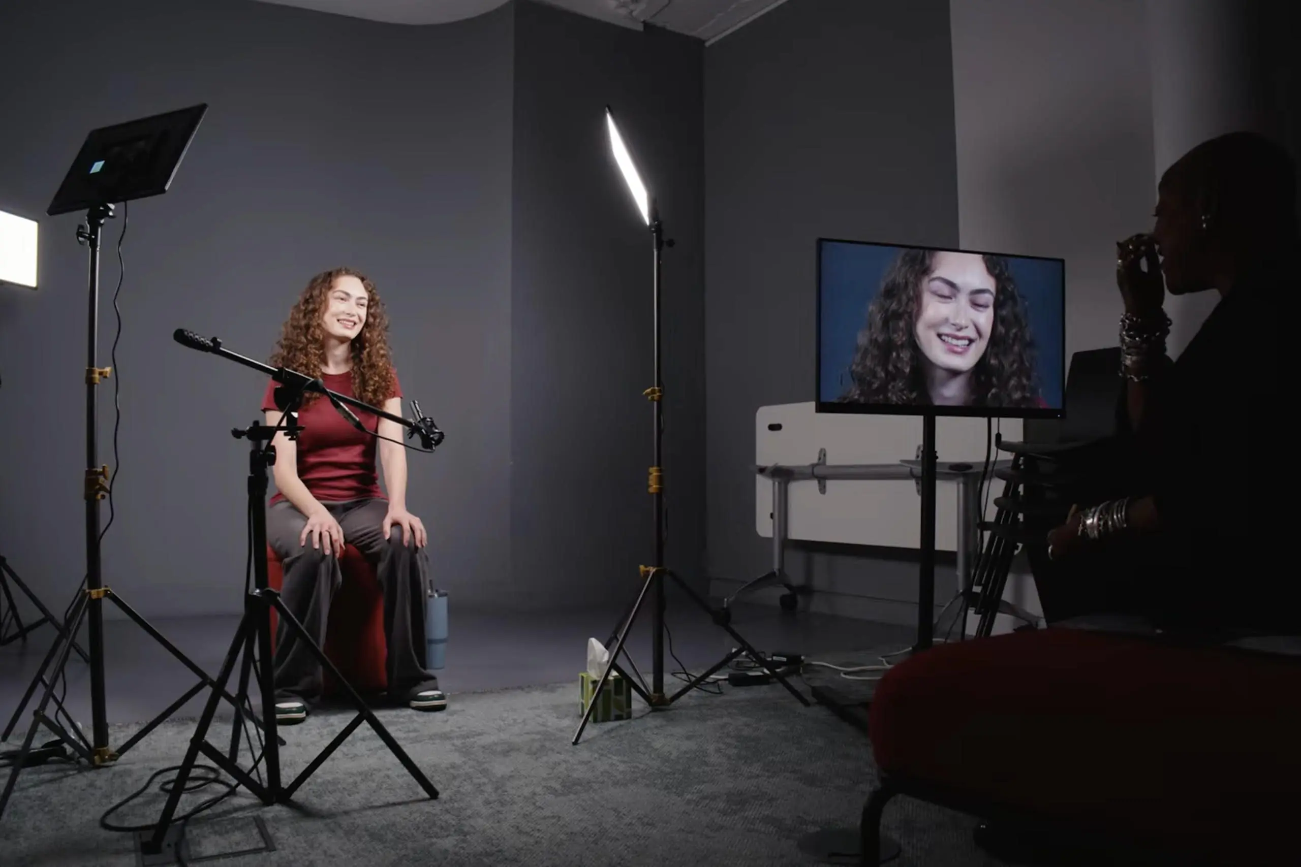 A Spotlight Screen Prize finalist sitting in front of a camera and lights in the Spotlight Studios