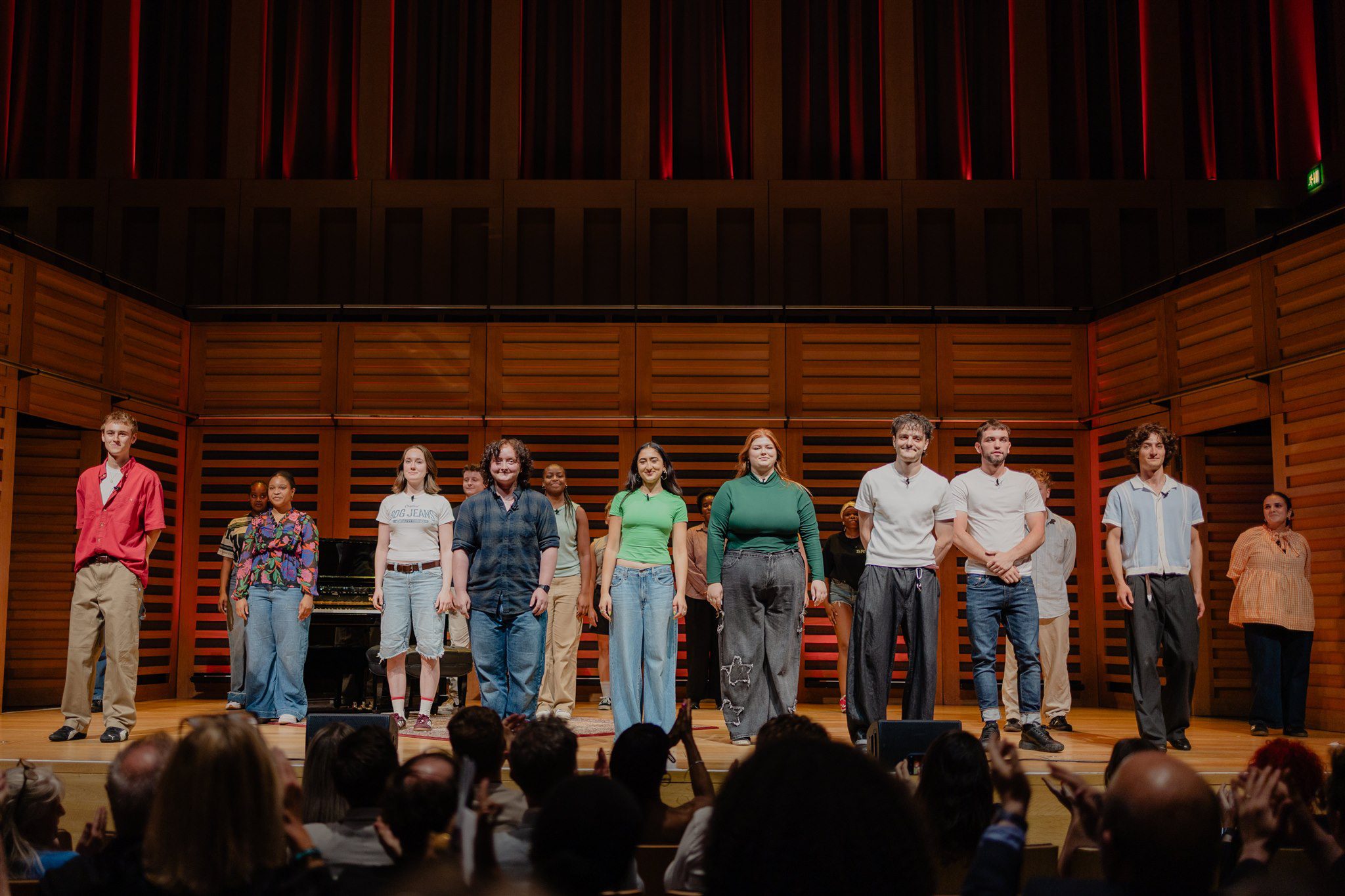 Graduates taking a curtain call onstage at Spotlight Prize
