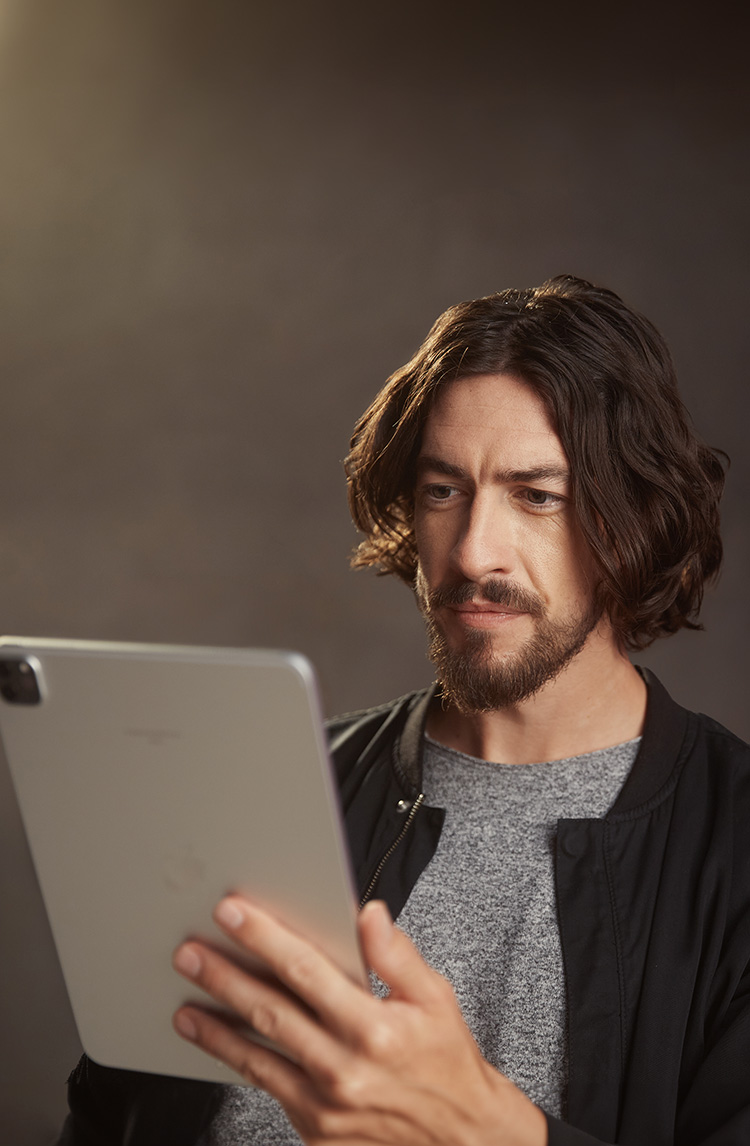 An actor looks at the Spotlight app on a tablet device.