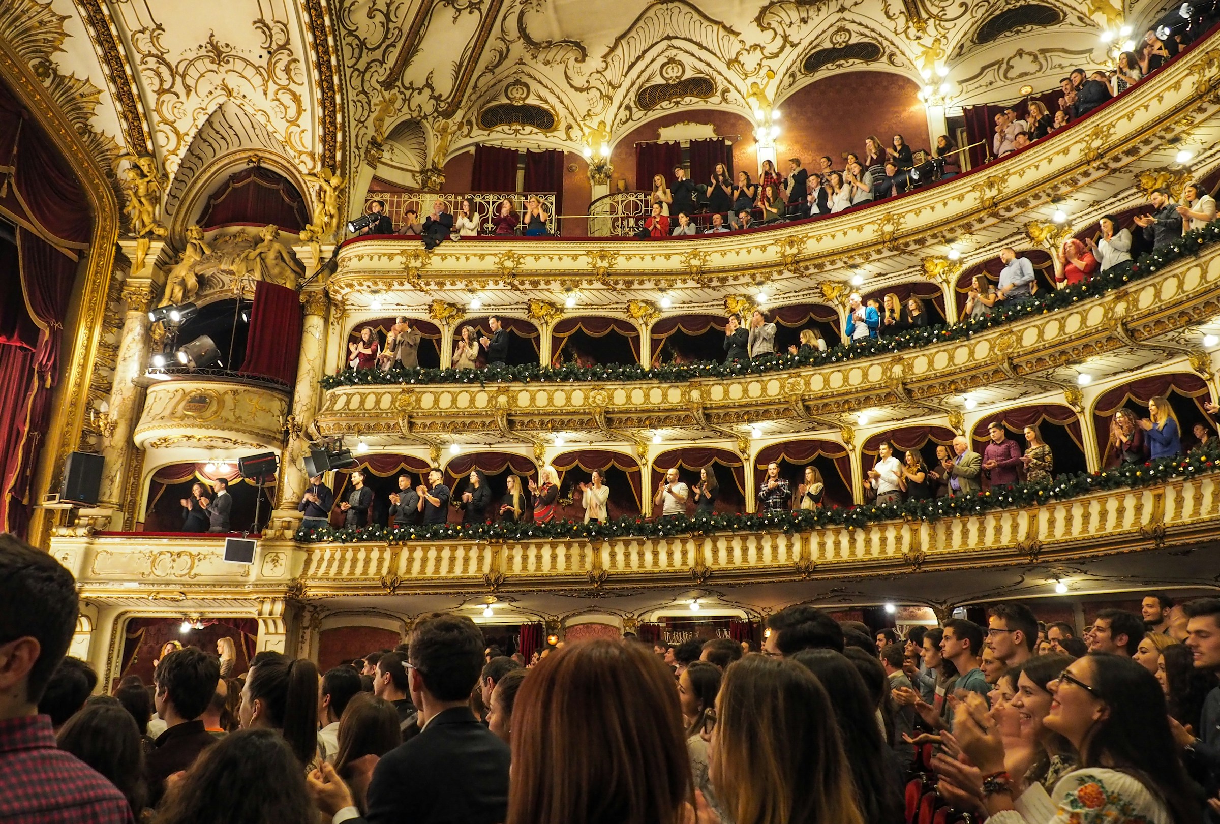 Theatre audience applauding at the end of a show