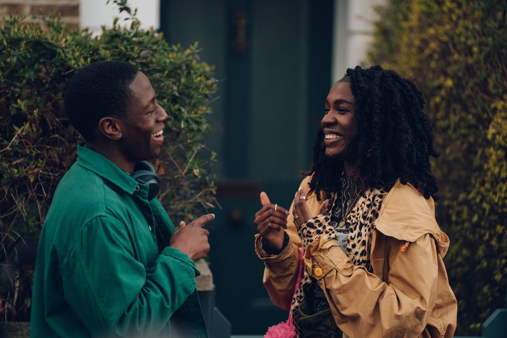 David Jonsson and Vivian Oparah talking outside a house door in 'Rye Lane'