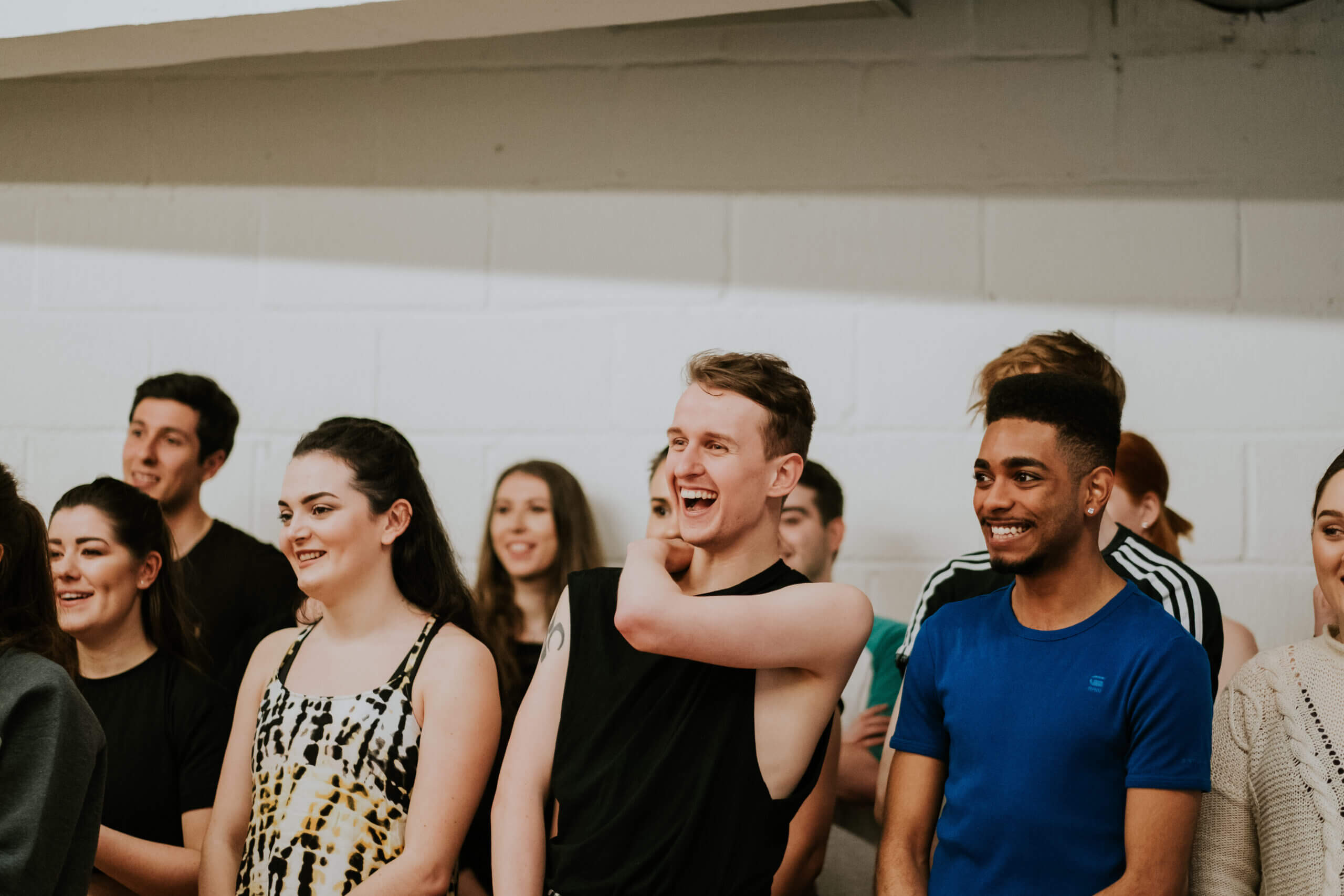 Spotlight members smiling and laughing at a workshop