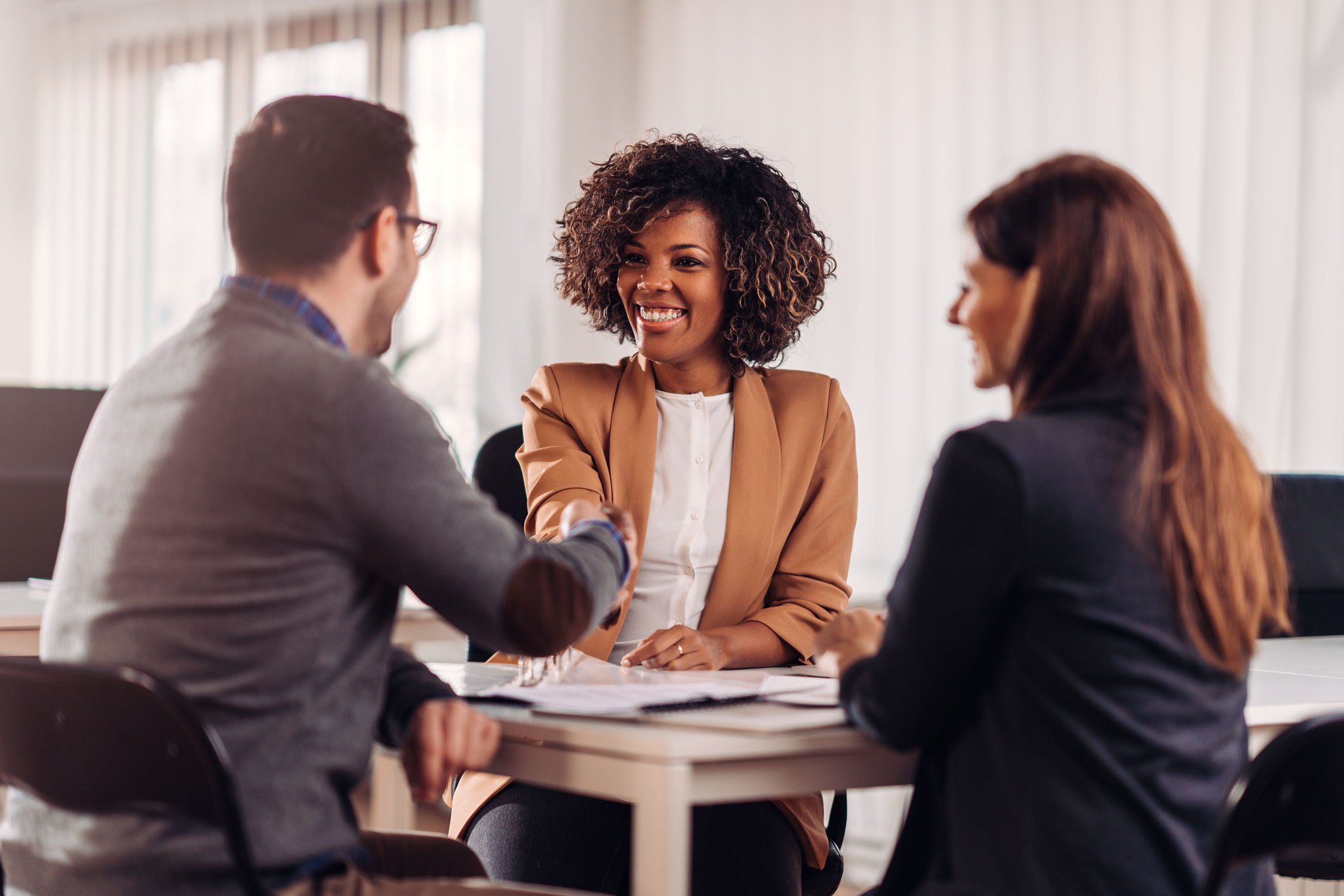 Female financial manager giving advice to a couple