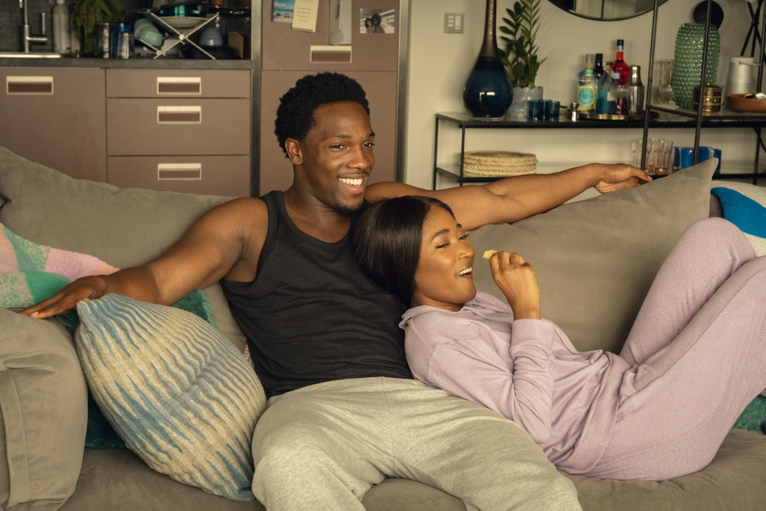 Two characters from 'Supecell' sitting on a sofa together