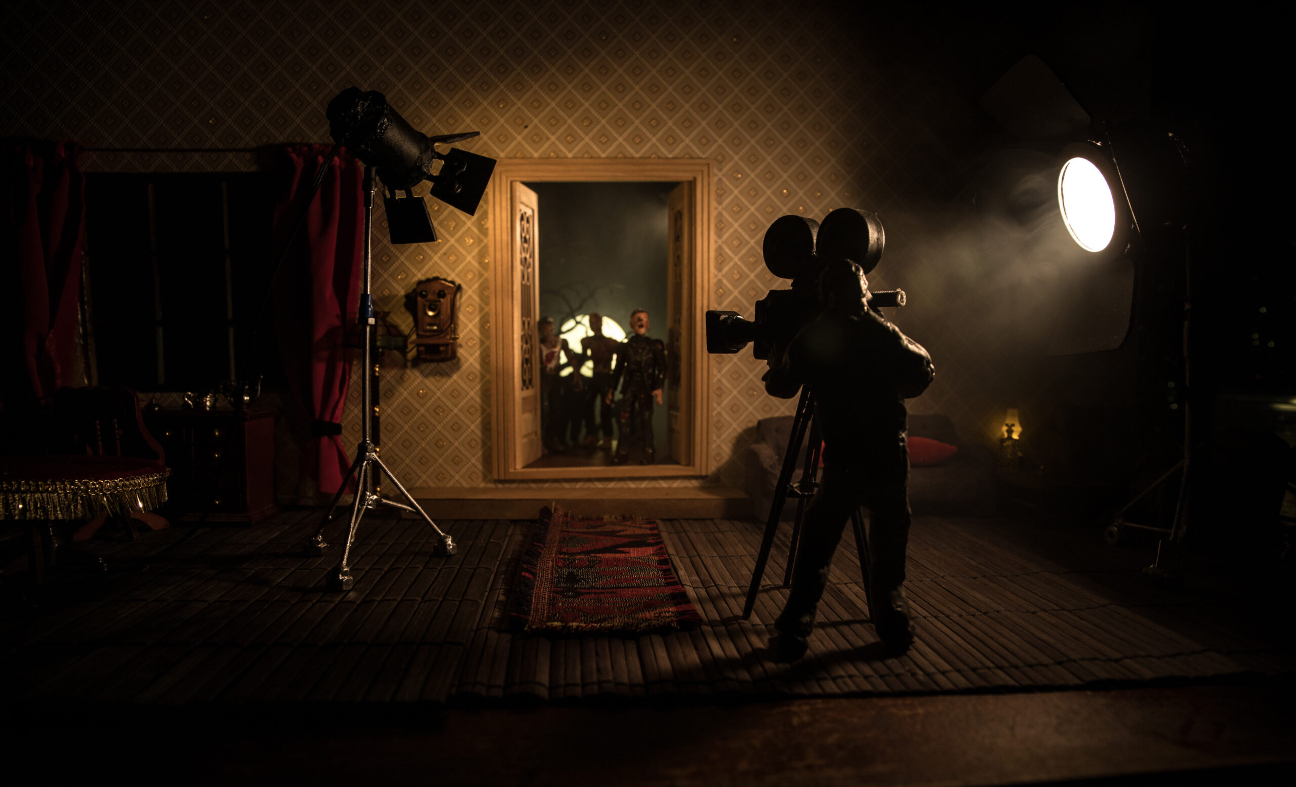 Filming on the set of a horror film from within a dimly lit house house