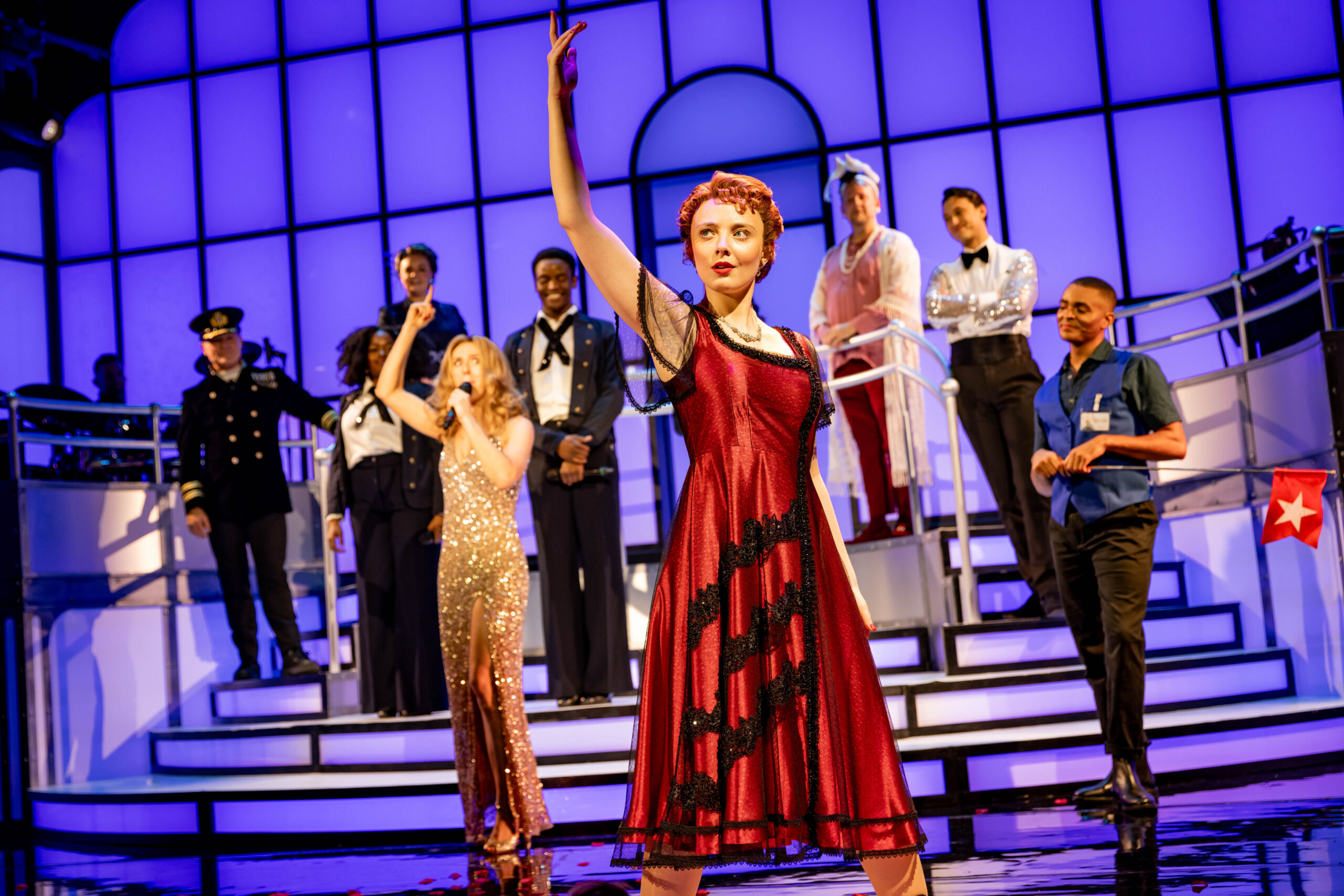 Singers on stage performing in 'Titanique' the musical