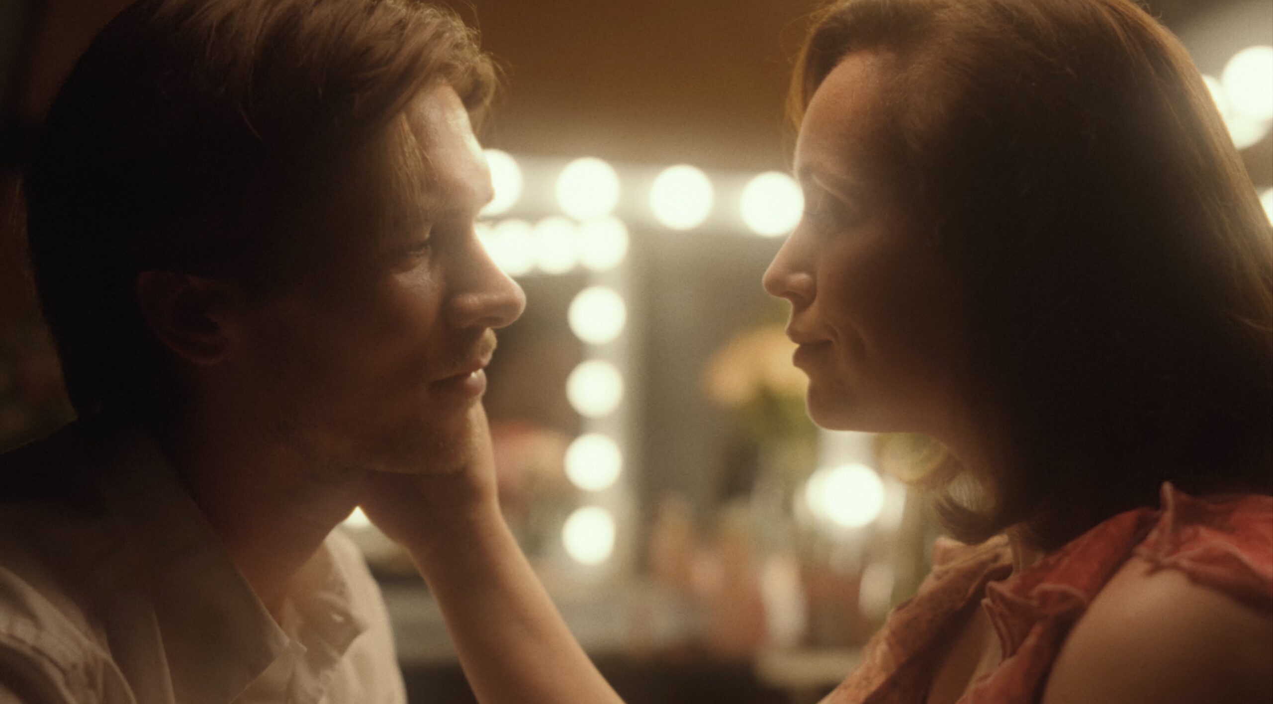 Bradley Peake opposite an actress in a dressing room