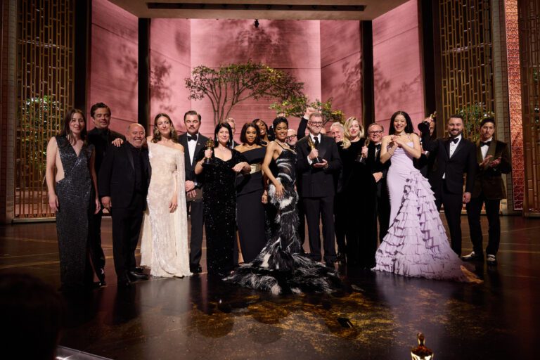Paul Thomas Anderson, Sarah Murphy, Anthony Carlino, Will Weiske, Andy Jurgensen, Teyana Taylor, Michael Bauman, Cassandra Kulukundis, Regina Hall, Shayna McHale aka Junglepussy, Leonardo DiCaprio, Chase Infiniti and Benicio del Toro accept the Oscar for Best Picture