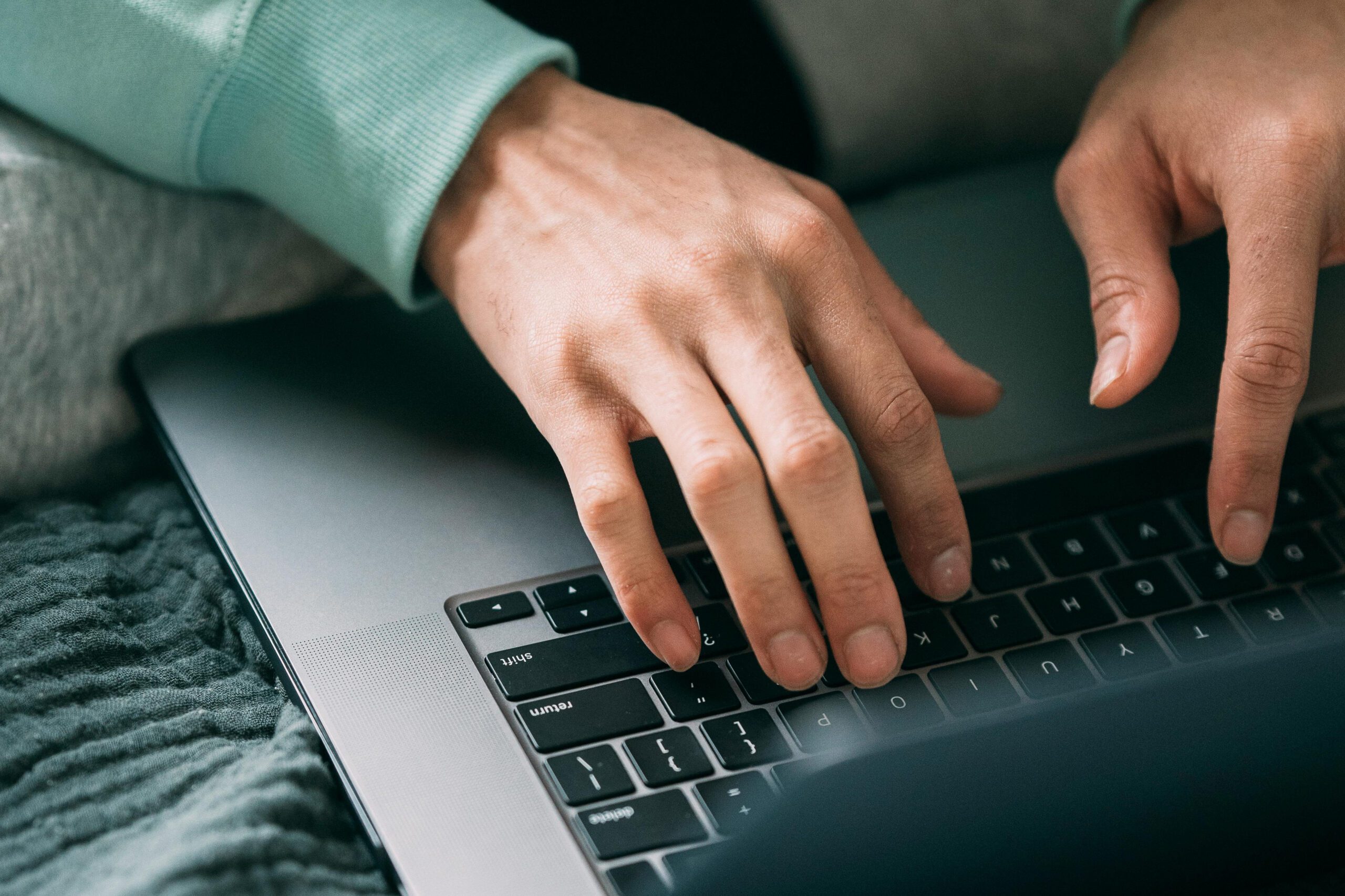 Person typing on a keyboard
