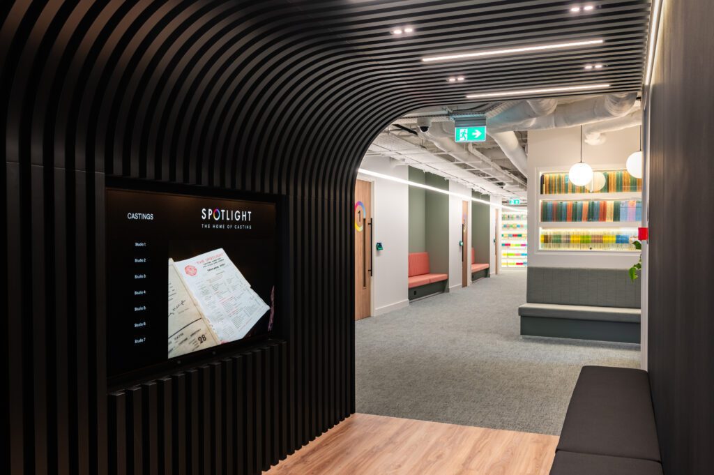Interior corridor of Spotlight studios with modern lighting and seating area
