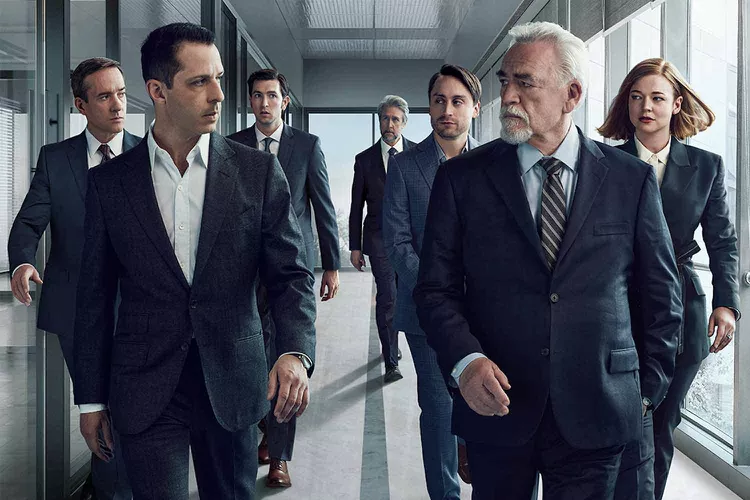 Group of businessmen walking through an office corridor