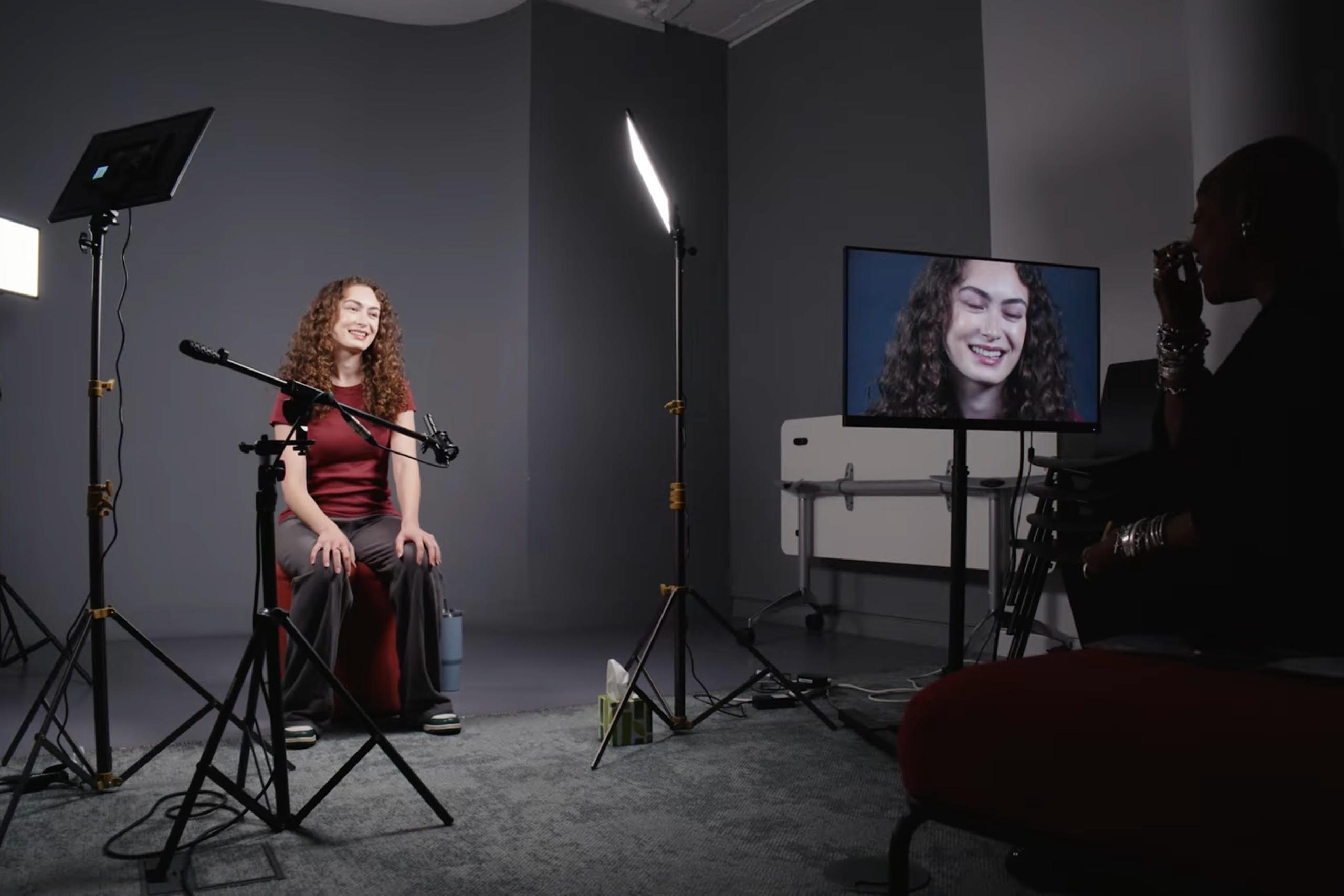 A Spotlight Screen Prize finalist sitting in front of a camera and lights in the Spotlight Studios